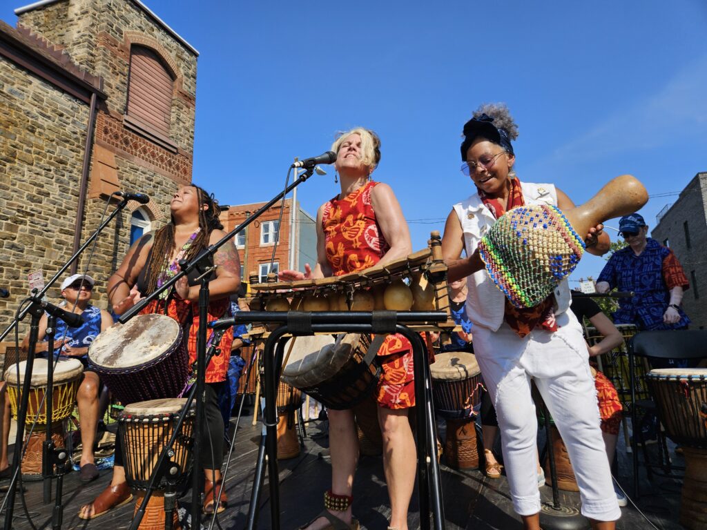 Bele Bele rhythm Collective on stage at an outdoor performance