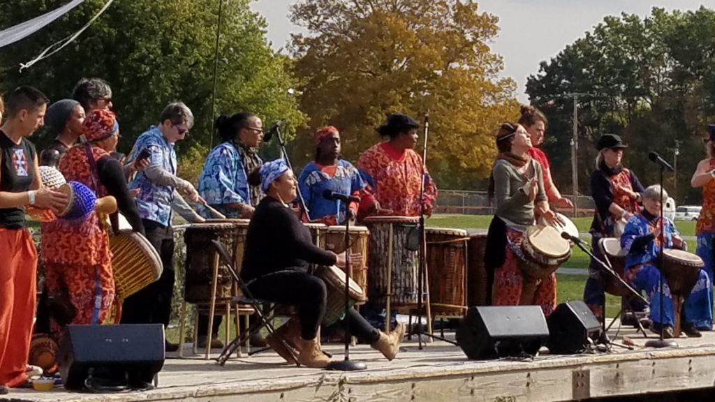 Bele Bele Rhythm Collective members performing on an outdoor stage