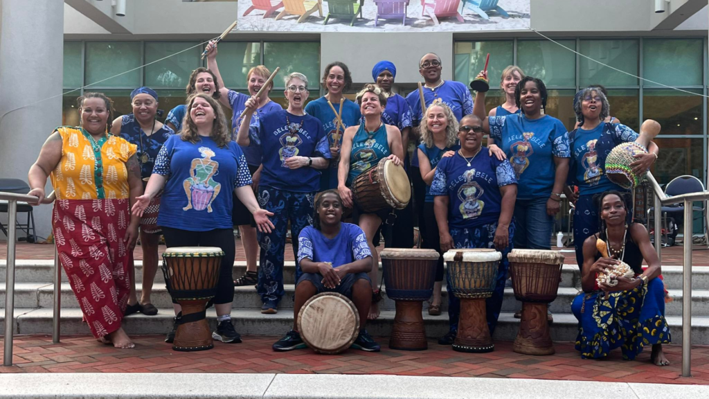 Group photo of 2024 Bele Bele Rhythm Collective members in matching blue t-shirts.