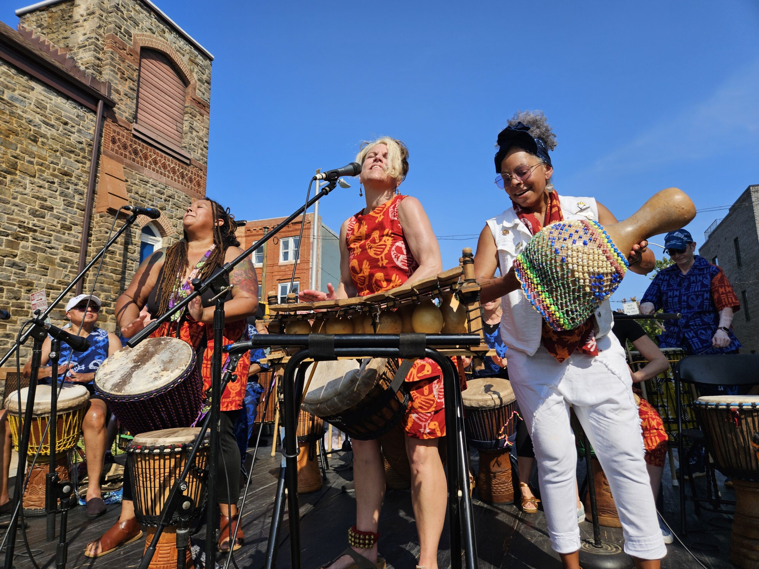 Bele Bele performing outdoors on a beautiful, sunny day